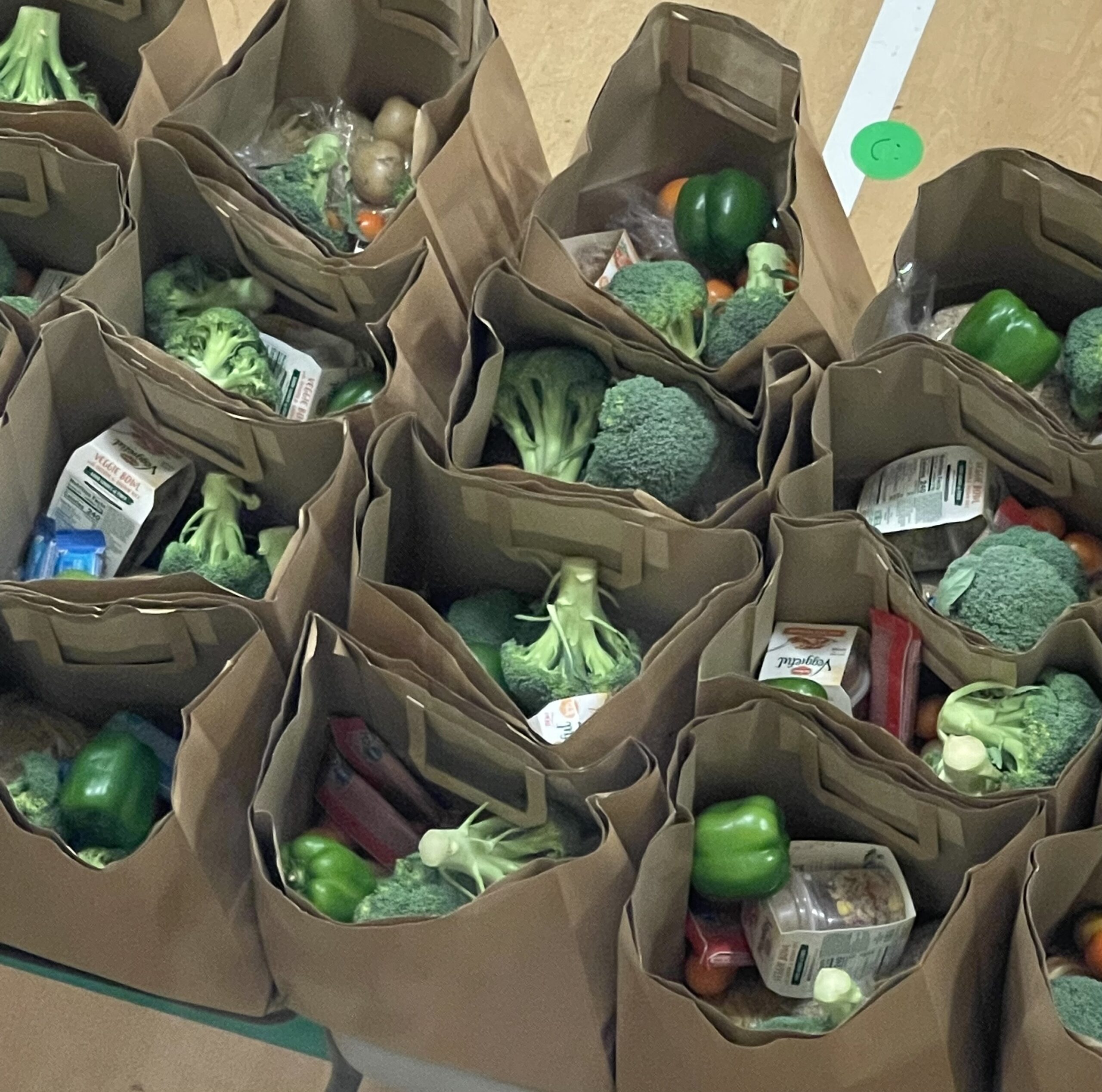 Grocery sacks of food prepared for giving out to those in need.