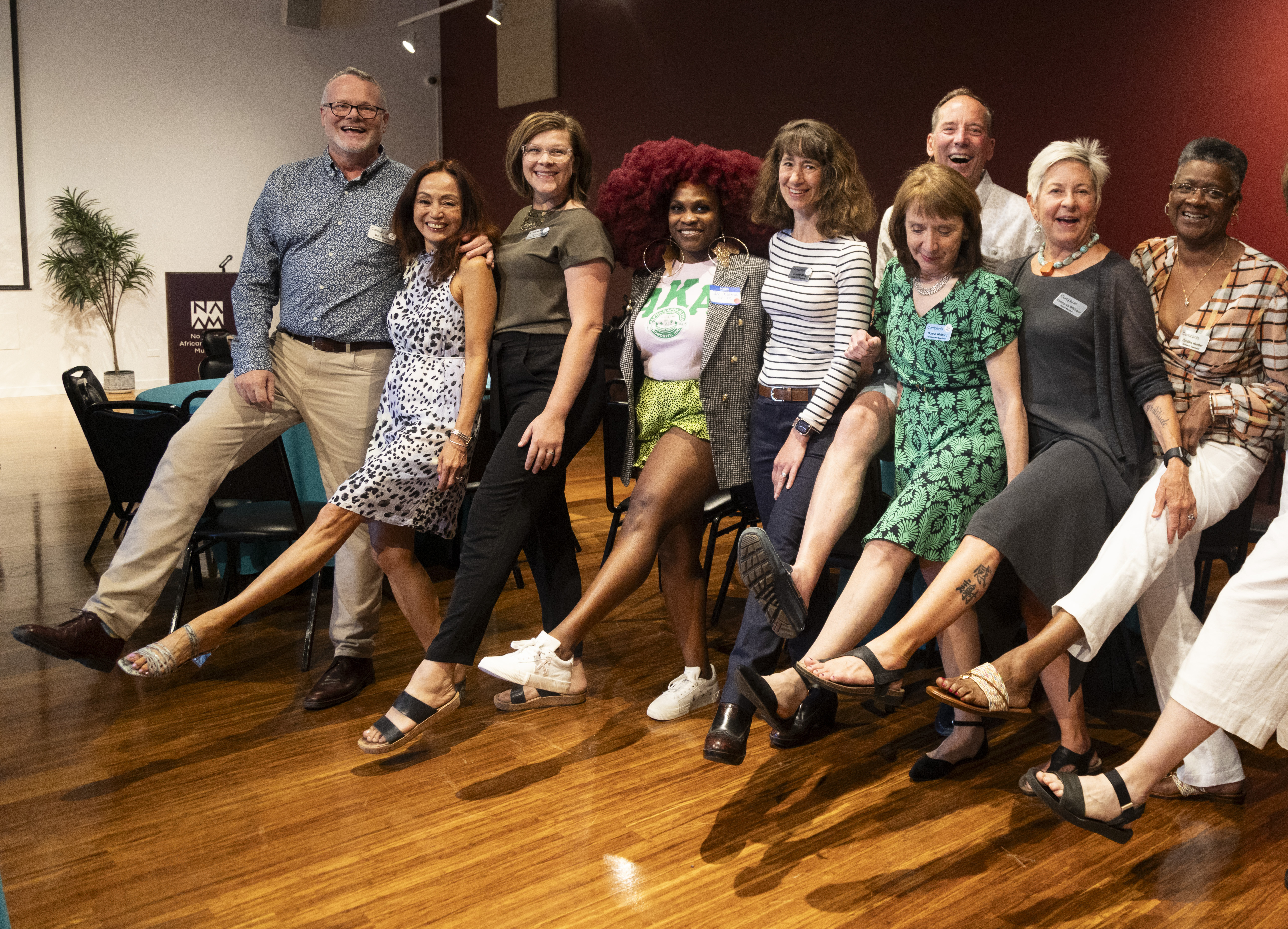 Companis staff, guests and volunteers kick up their heels after our summer Spotlight event at the Northwest African American Museum